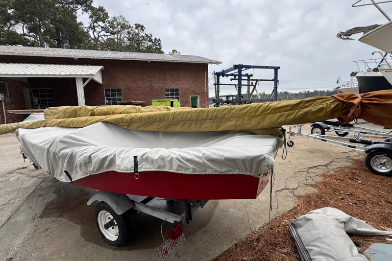 Slide: The Image of 1986 One Design Point Jude 16 sailboat on trailer, covered and stored outdoors. - 10