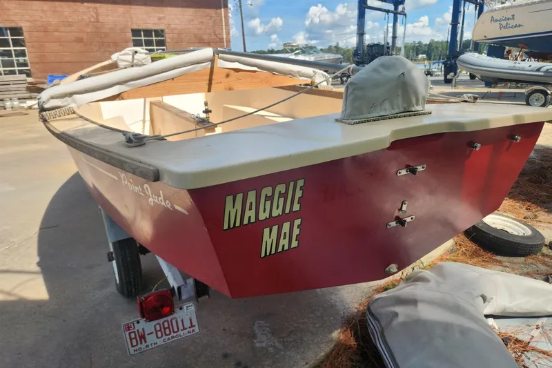 Slide: The Image of Red Point Jude 16 sailboat from 1986 named "Maggie Mae" on a trailer. - 4