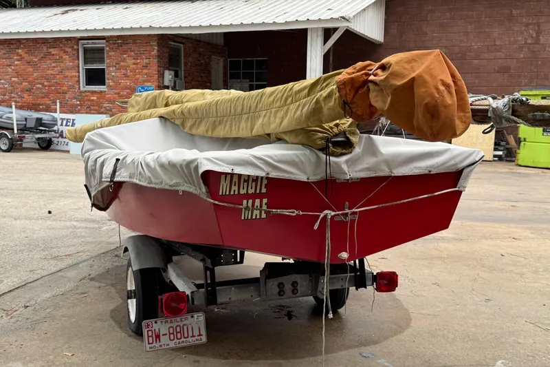 Slide: The Image of Red 1986 One Design Point Jude 16 sailboat on trailer, covered and parked. - 9
