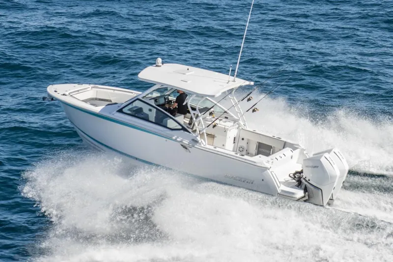 Slide: The Image of Manufacturer Provided Image: 2026 Blackfin 272 DC boat cruising on open water, showcasing sleek design and powerful performance. - 1
