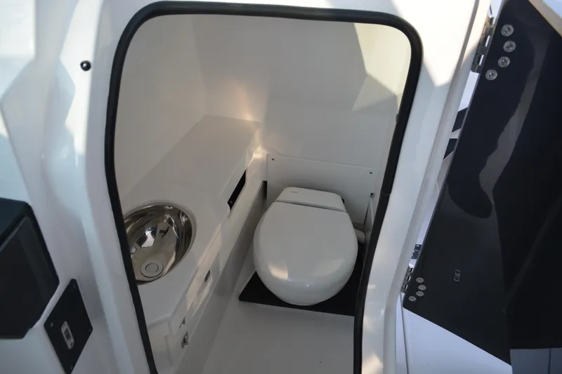 Slide: The Image of 2026 Blackfin 272 DC boat interior bathroom with modern toilet and sink. - 14