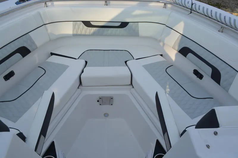 Slide: The Image of Luxurious seating area on 2026 Blackfin 272 DC boat, featuring elegant white and gray upholstery. - 18