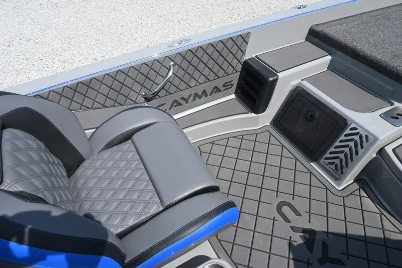 Slide: The Image of 2026 Caymas CX21 boat interior with quilted seats and textured flooring. - 4