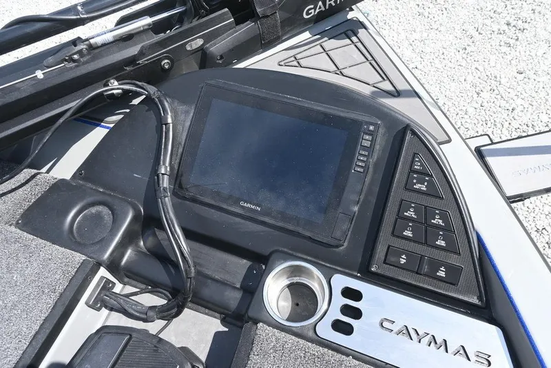 Slide: The Image of 2026 Caymas CX21 boat dashboard with Garmin display and control panel. - 7