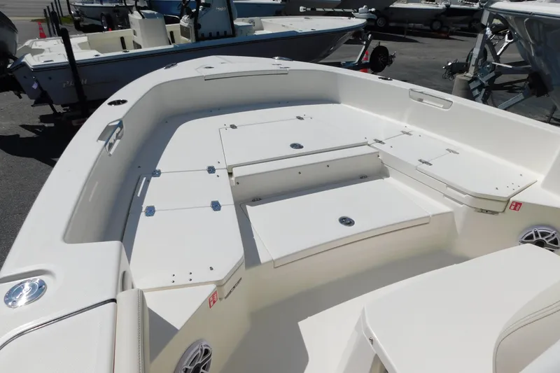 Slide: The Image of 2026 Pathfinder 2400 TRS boat interior with spacious seating and storage compartments. - 19
