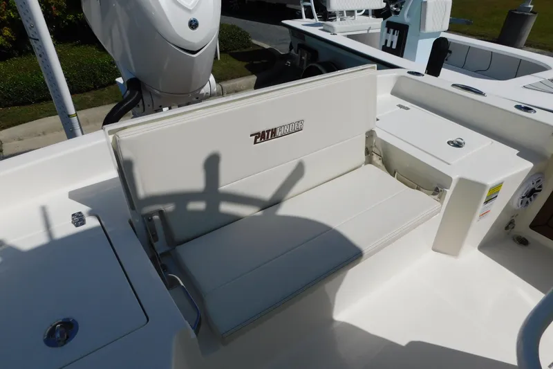 Slide: The Image of 2026 Pathfinder 2400 TRS boat interior with foldable seating and storage compartments. - 22