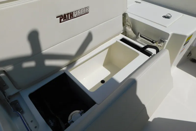 Slide: The Image of 2026 Pathfinder 2400 TRS boat interior with storage compartments and seating. - 24