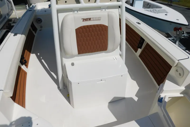 Slide: The Image of 2026 Pathfinder 2400 TRS boat interior with cushioned seating and sleek design. - 34