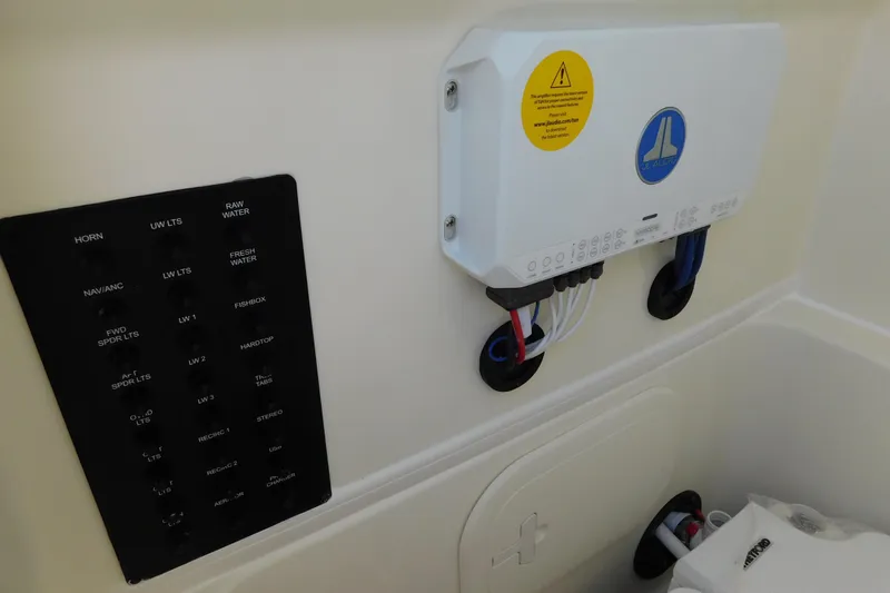 Slide: The Image of Control panel and wiring in a 2026 Pathfinder 2400 TRS boat interior. - 36