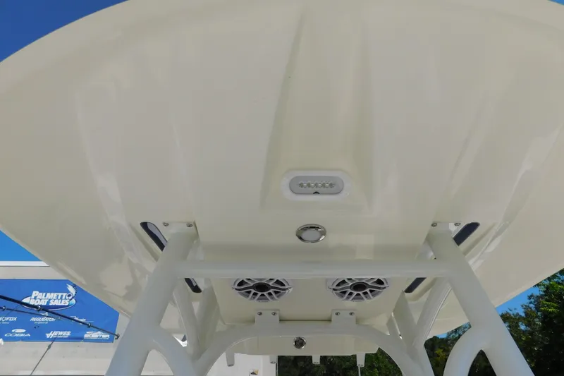 Slide: The Image of 2026 Pathfinder 2400 TRS boat canopy with speakers and lights, viewed from below. - 39