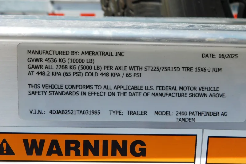 Slide: The Image of Label on 2026 Pathfinder 2400 TRS trailer detailing specifications and safety standards compliance. - 45