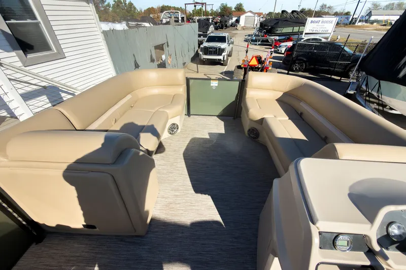 Slide: The Image of 2026 Godfrey Sweetwater Xperience 22' Tritoon with beige split bench seating. - 27