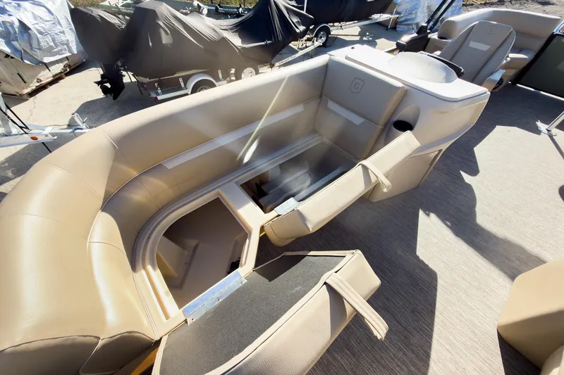 Slide: The Image of 2026 Godfrey Sweetwater Xperience 22' Tritoon interior with split bench seating and storage. - 29