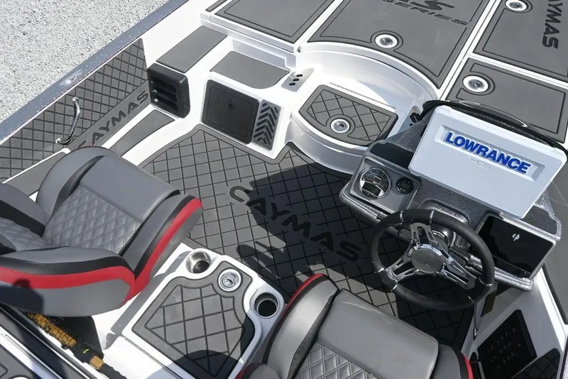 Slide: The Image of 2026 Caymas XS 21 boat interior with Lowrance electronics and stylish seating. - 11