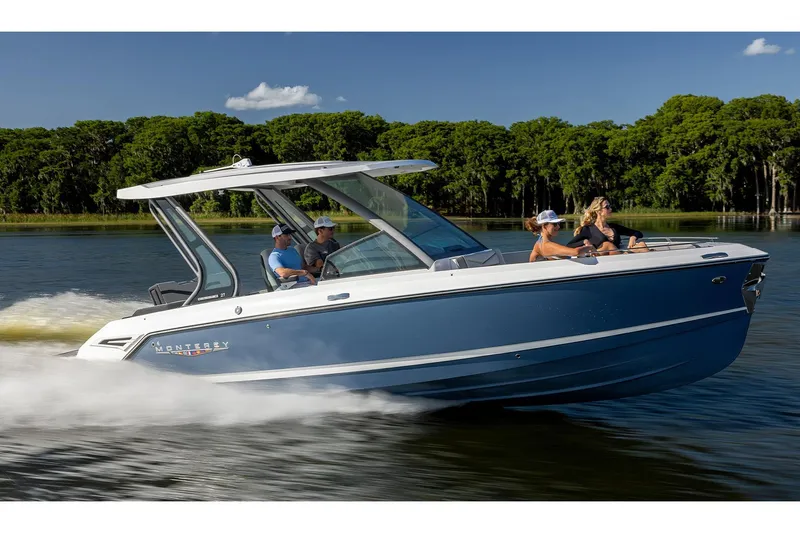 Slide: The Image of 2026 Monterey Elite 27 SD boat on trailer in showroom. - 0