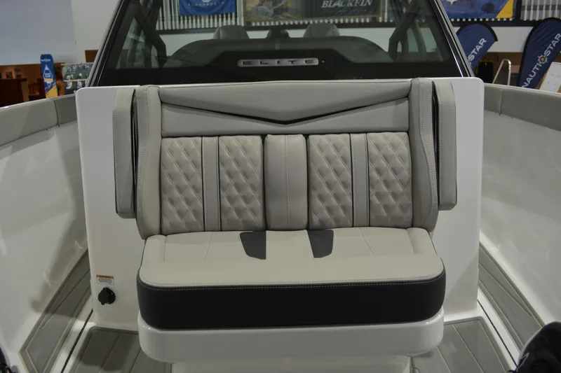 Slide: The Image of 2026 Monterey Elite 27 SD boat interior with luxurious, quilted seating design. - 13