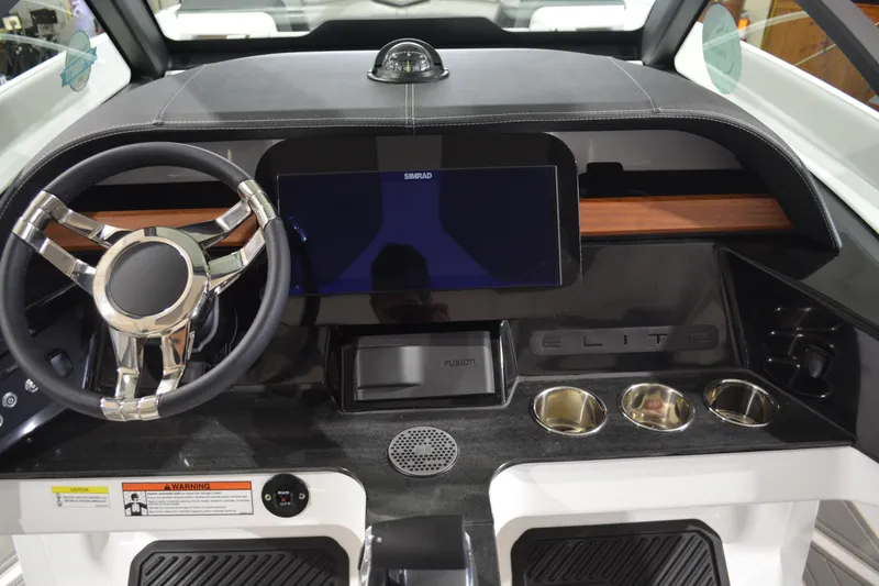 Slide: The Image of 2026 Monterey Elite 27 SD dashboard with steering wheel, touchscreen, and cup holders. - 18