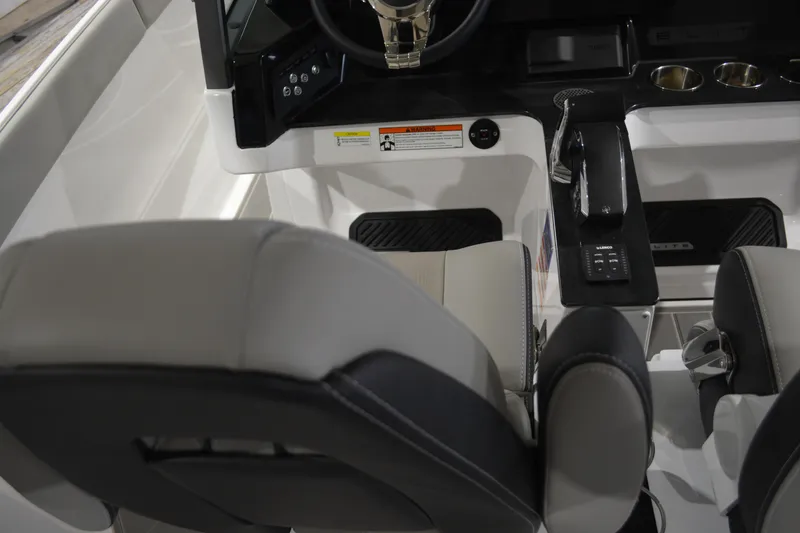 Slide: The Image of Interior cockpit of 2026 Monterey Elite 27 SD boat with steering and controls. - 19