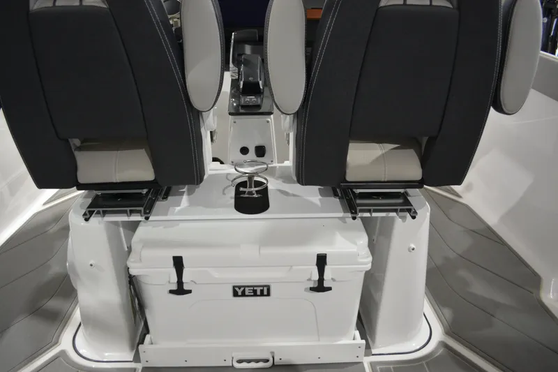 Slide: The Image of 2026 Monterey Elite 27 SD boat interior with Yeti cooler and seating. - 21