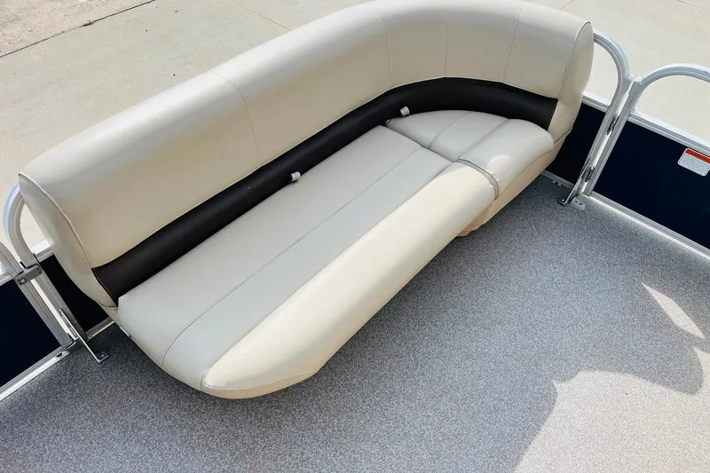 Slide: The Image of 2019 Sun Tracker Party Barge 18 DLX pontoon boat seating, beige and black upholstery. - 13