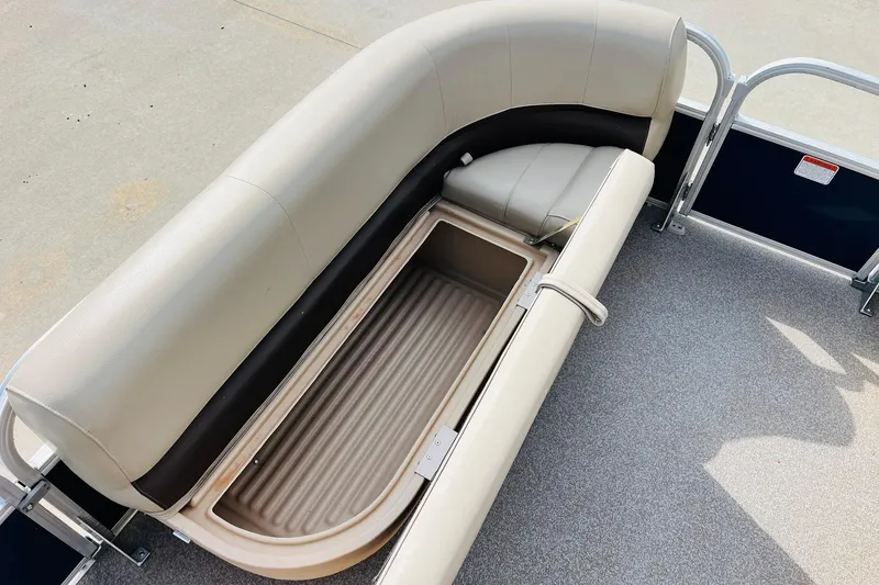 Slide: The Image of 2019 Sun Tracker Party Barge 18 DLX with open storage compartment and cushioned seating. - 14