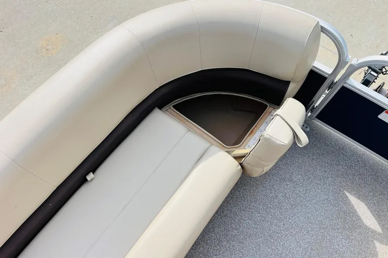 Slide: The Image of 2019 Sun Tracker Party Barge 18 DLX seating with storage compartment open. - 15