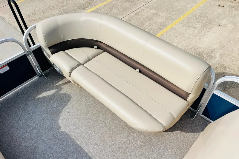 Slide: The Image of 2019 Sun Tracker Party Barge 18 DLX pontoon boat seating, beige upholstery, outdoor setting. - 17