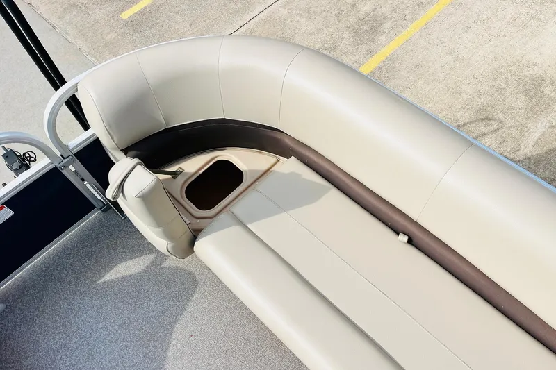 Slide: The Image of 2019 Sun Tracker Party Barge 18 DLX pontoon boat seating area with storage compartment. - 19
