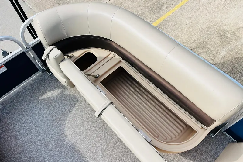 Slide: The Image of 2019 Sun Tracker Party Barge 18 DLX seating with storage compartment open. - 20