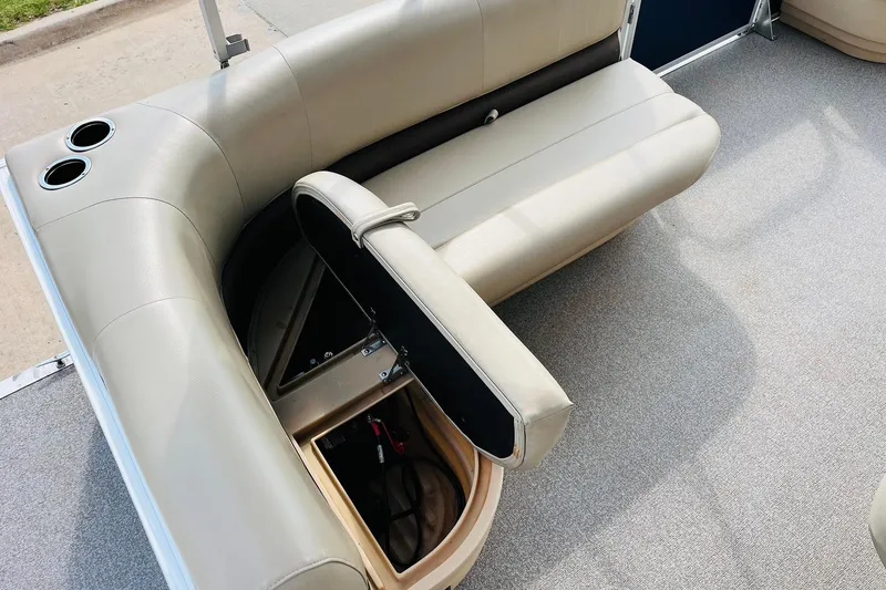Slide: The Image of 2019 Sun Tracker Party Barge 18 DLX with open storage compartment and cup holders. - 24