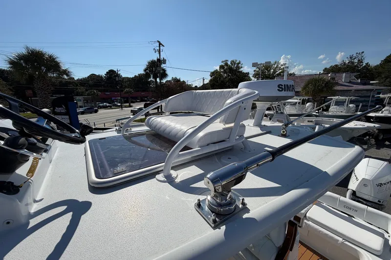 Slide: The Image of 2023 Costa Custom Boats 264 HC helm with seating and navigation equipment. - 22