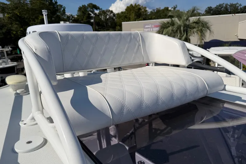 Slide: The Image of 2023 Costa Custom Boats 264 HC with white cushioned seating and elegant design. - 23