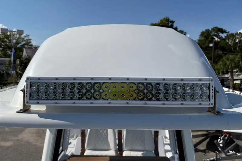 Slide: The Image of 2023 Costa Custom Boats 264 HC with mounted LED light bar on the roof. - 26