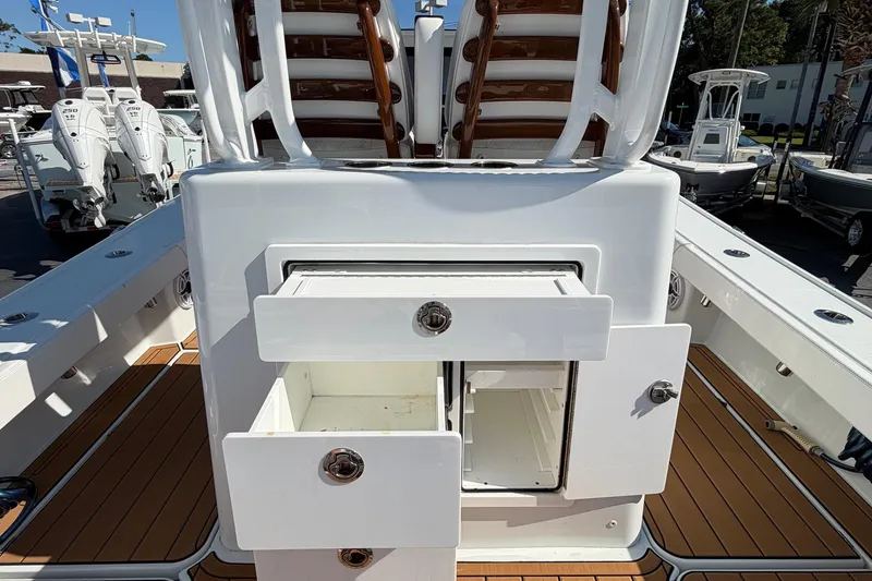 Slide: The Image of 2023 Costa Custom Boats 264 HC interior with open storage compartments. - 29