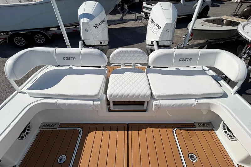 Slide: The Image of 2023 Costa Custom Boats 264 HC with white seating and dual engines, showcasing luxury design. - 31