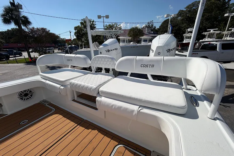 Slide: The Image of 2023 Costa Custom Boats 264 HC with white seating and teak flooring. - 33