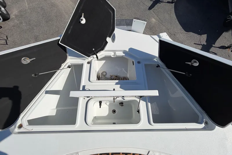 Slide: The Image of 2023 Costa Custom Boats 264 HC deck with open storage compartments. - 35