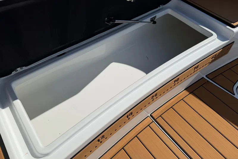 Slide: The Image of 2023 Costa Custom Boats 264 HC storage compartment with teak flooring. - 37