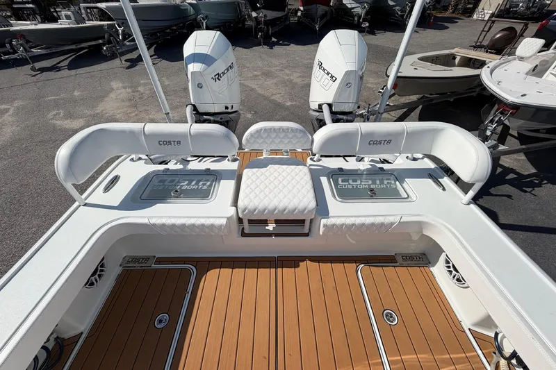 Slide: The Image of 2023 Costa Custom Boats 264 HC with dual engines and teak deck. - 39