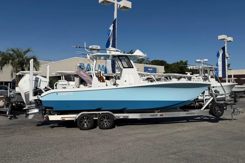 Slide: The Image of 2023 Costa Custom Boats 264 HC on trailer, displayed outdoors at dealership. - 4