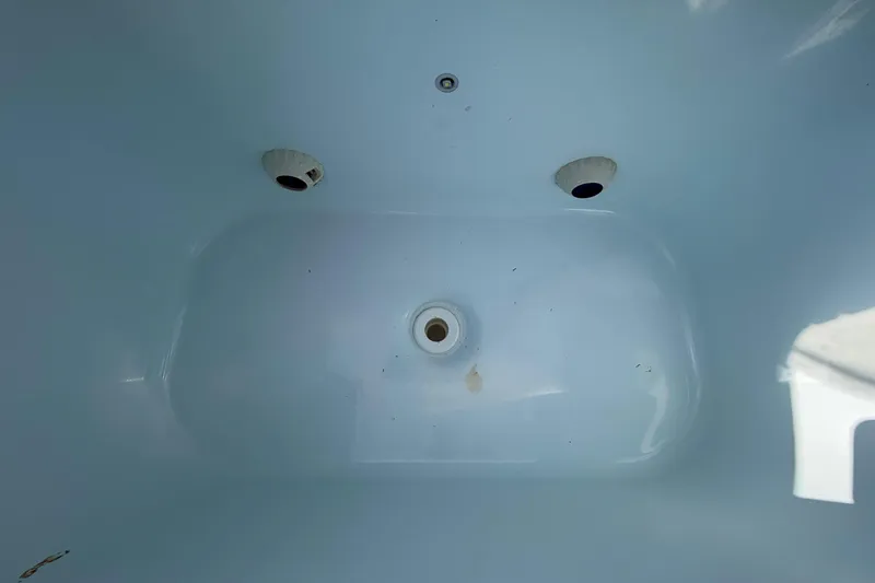 Slide: The Image of Interior view of 2023 Costa Custom Boats 264 HC, showcasing clean white surface. - 40