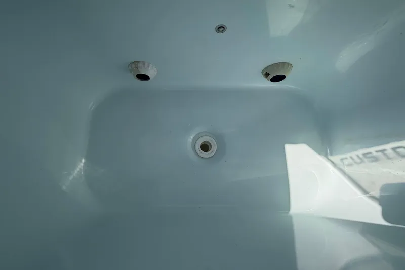 Slide: The Image of Interior view of 2023 Costa Custom Boats 264 HC, showcasing clean, white surface details. - 41