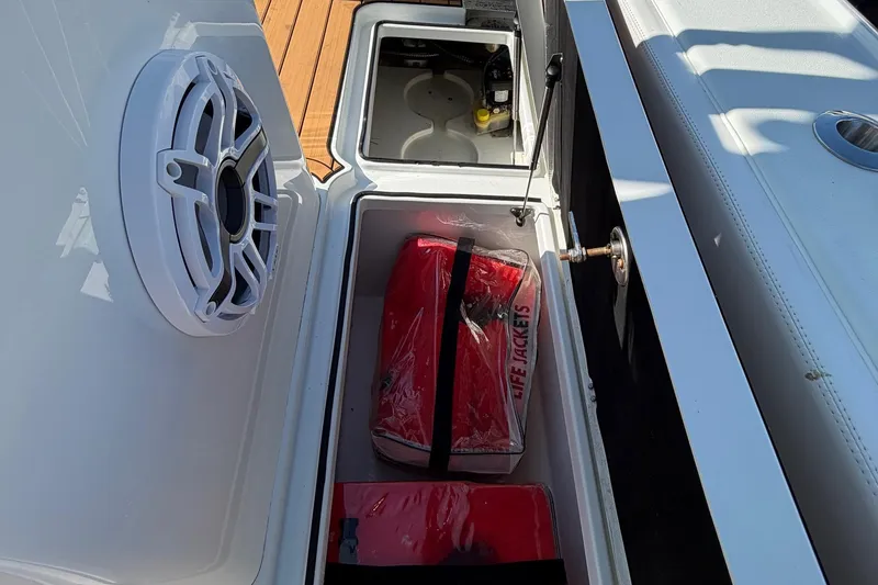 Slide: The Image of 2023 Costa Custom Boats 264 HC storage with life jackets and speaker. - 42