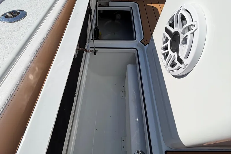 Slide: The Image of 2023 Costa Custom Boats 264 HC interior storage and speaker detail. - 43
