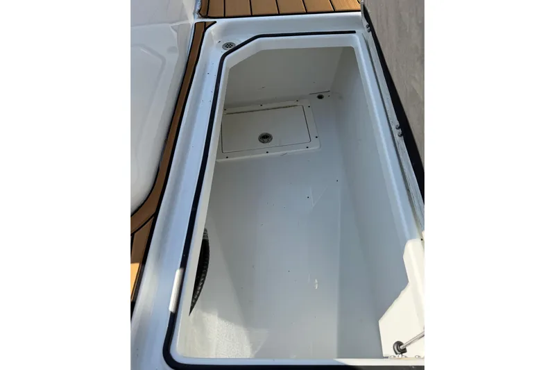 Slide: The Image of Storage compartment of 2023 Costa Custom Boats 264 HC, featuring sleek design and spacious interior. - 45