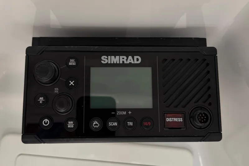 Slide: The Image of Simrad marine radio on 2023 Costa Custom Boats 264 HC dashboard. - 46