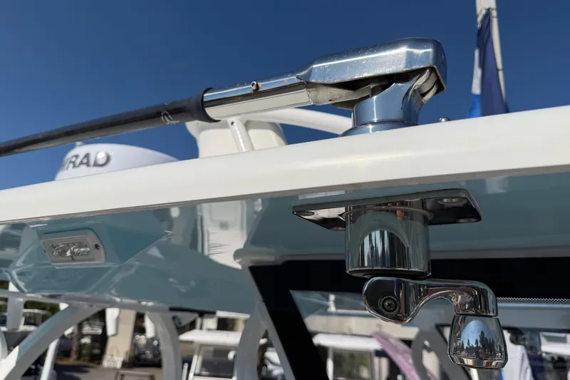 Slide: The Image of Close-up of 2023 Costa Custom Boats 264 HC hardware and radar against blue sky. - 48