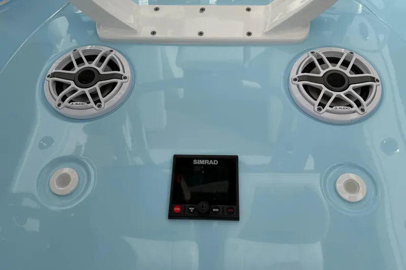 Slide: The Image of 2023 Costa Custom Boats 264 HC dashboard with JL Audio speakers and Simrad display. - 49