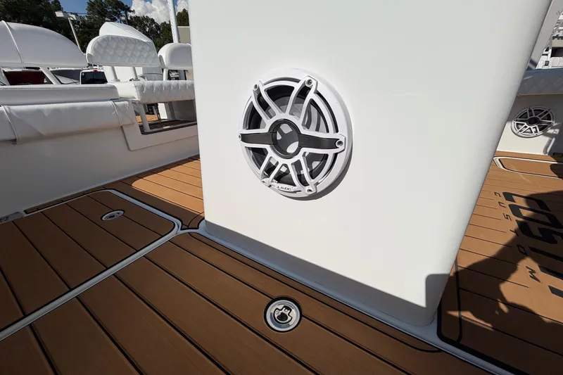 Slide: The Image of 2023 Costa Custom Boats 264 HC interior with speaker and teak flooring. - 50