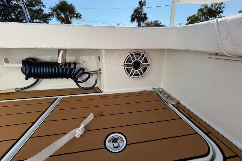 Slide: The Image of 2023 Costa Custom Boats 264 HC interior with teak flooring and speaker system. - 51